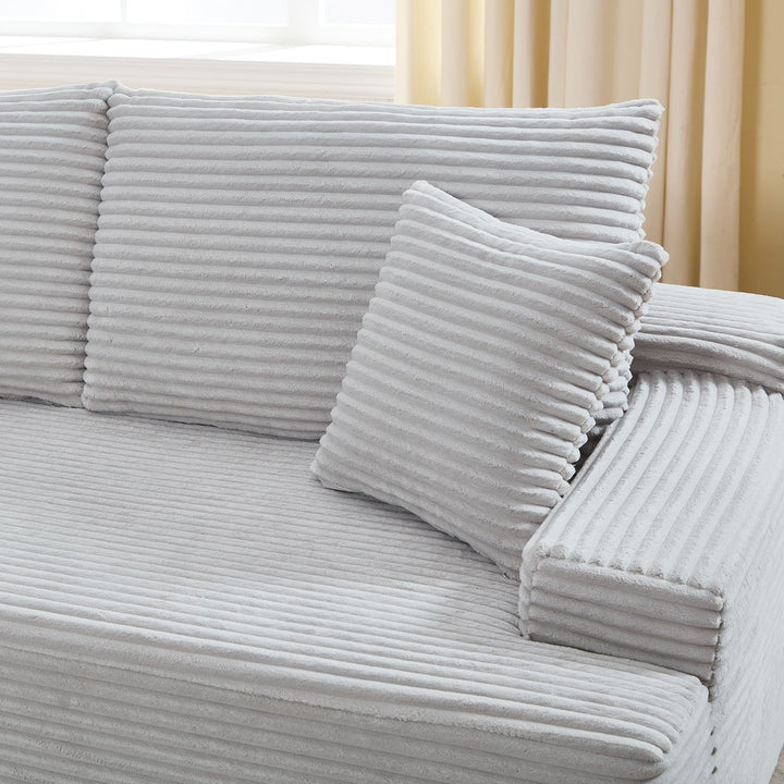 Canapé Coredo avec revêtement en velours côtelé et coussins décoratifs