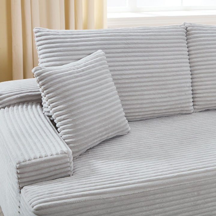 Canapé Coredo avec revêtement en velours côtelé et coussins décoratifs